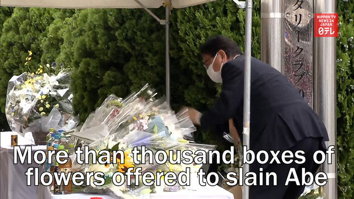 More than thousand boxes of flowers offered to slain Abe
