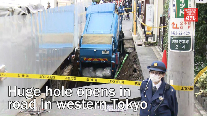 Huge hole opens in road in western Tokyo