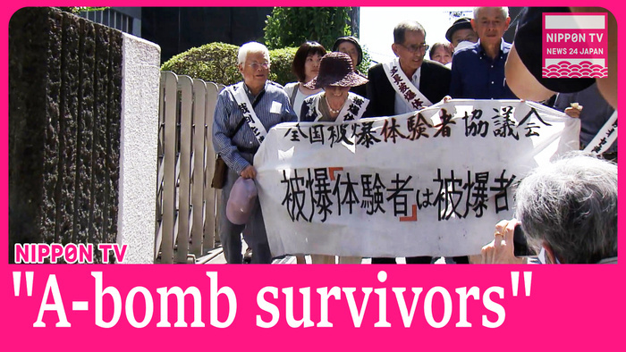  Nagasaki District Court rules some of plaintiffs be issued hibakusha health certificates