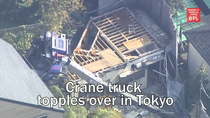 Crane truck topples over in Tokyo