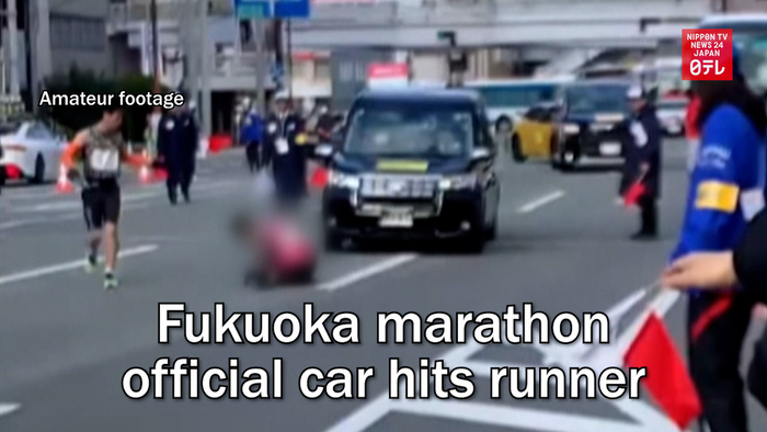 Fukuoka marathon official car hits runner