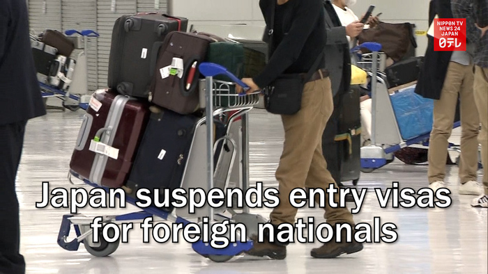 Japan suspends entry visas for foreign nationals