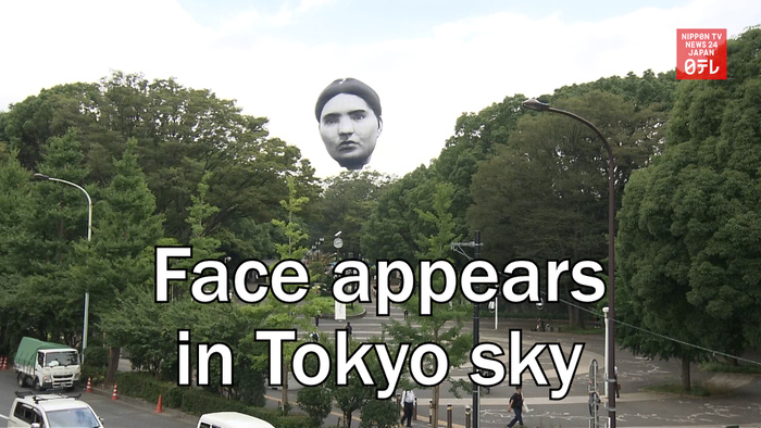 Face appears in Tokyo sky