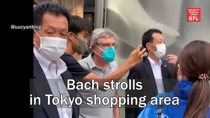 Bach strolls in Tokyo shopping area